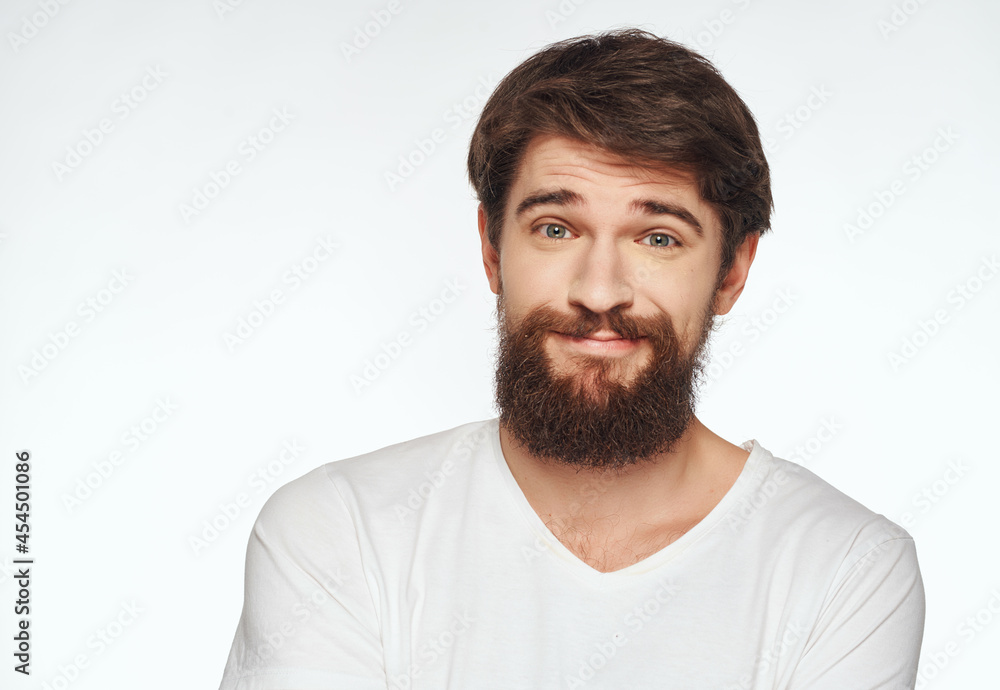 Man in a white t-shirt hand gestures anger Studio Man in a white t-shirt hand gestures anger Studio