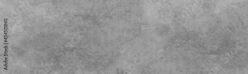 Old rough grey painted wall texture with grungy distressed. Texture of a plaster wall for background design