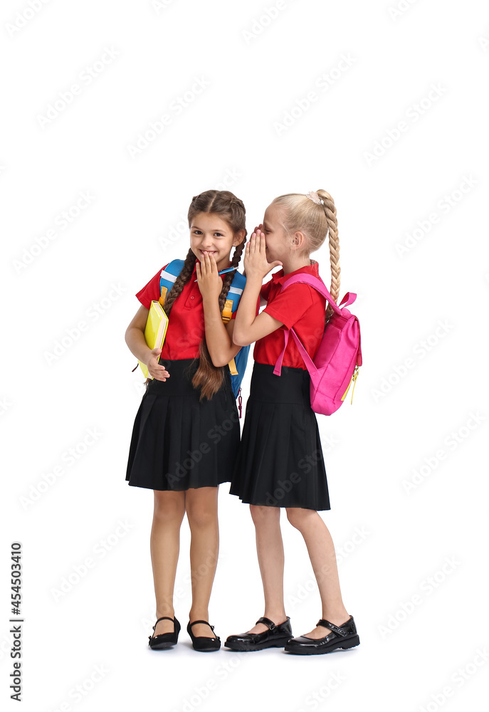 Cute gossiping schoolgirls on white background Cute gossiping schoolgirls on white background