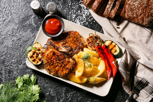 Plate with tasty pork steak...