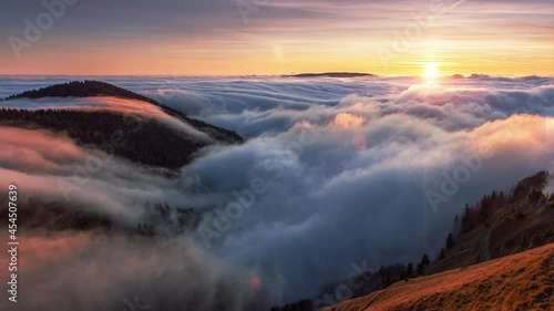 Dramatic sunrise in mountain with sun and beautiful clouds, Slovakia