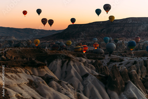 Early morning in Cappadocia, the flight of balloons. A large number of flying balloons in Cappadocia, Turkey. Flying on balloons. Festival of balloons. Copy space