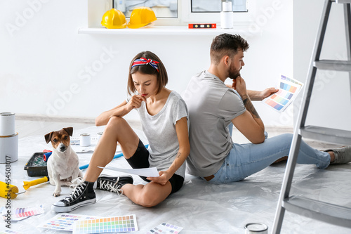 Young couple with cute dog ...