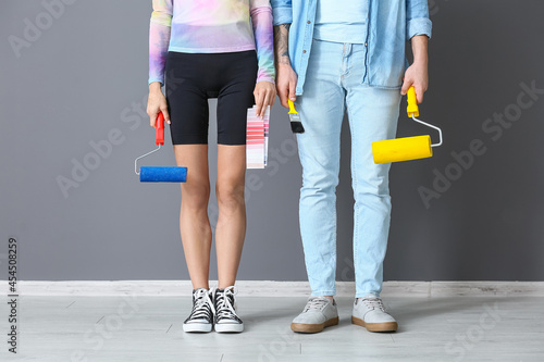 Young couple with paint rol...