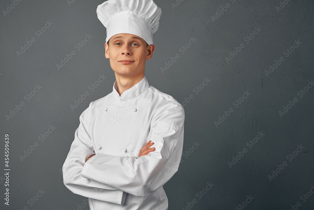 Cheerful chef folded his hands in front of him uniform work Cheerful chef folded his hands in front of him uniform work