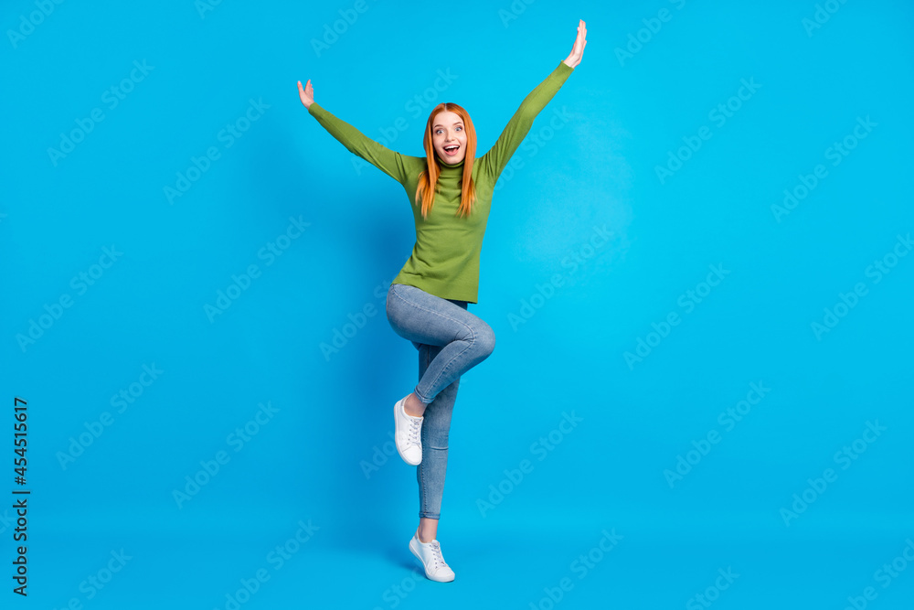 Full length body size view of attractive cheerful girlish funny girl jumping fooling isolated over bright blue color background