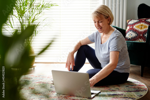 Active senior woman using computer photo