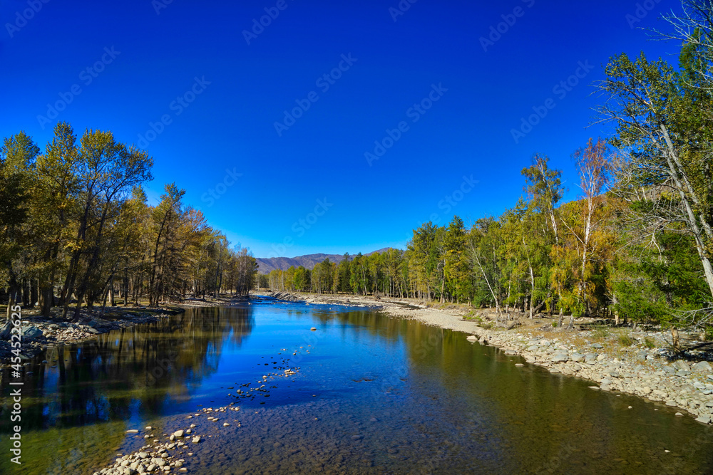 Poetic landscapes, clean blue skies, clear rivers, and lush trees, canyon.