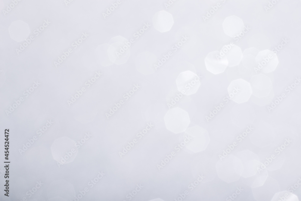 Silver glowing sparkles blurred background Silver glowing sparkles blurred background