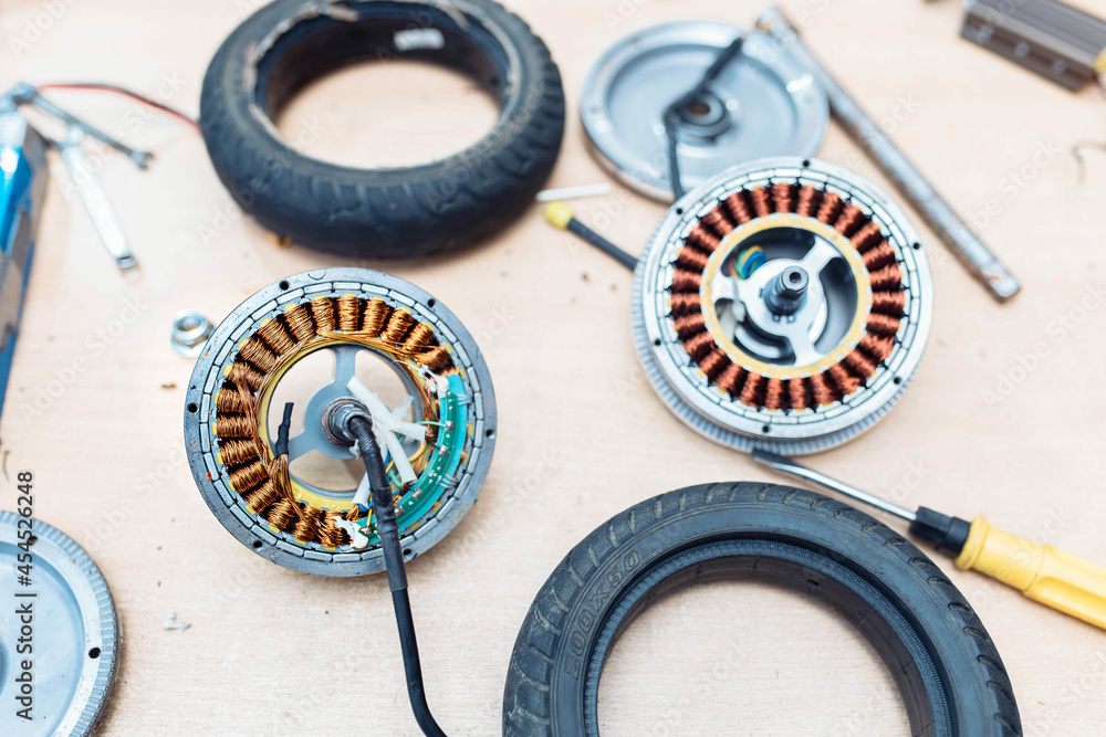 Fototapeta premium maintenance of electric vehicles, electric scooter repair.