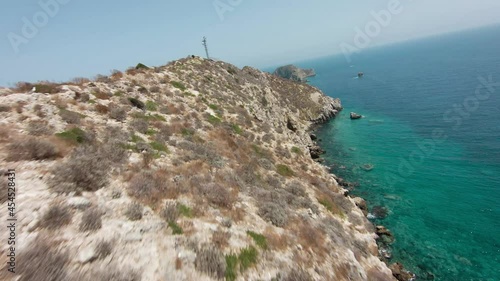 Aerial FPV Drone flying on rocky island Palagruza, Croatia. Mediterranean Sea photo