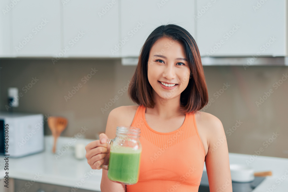 Detox Smoothie Diet Drink. Healthy Woman With Fit Body Drinking Fresh Organic Detox Smoothie Diet Drink. Healthy Woman With Fit Body Drinking Fresh Organic