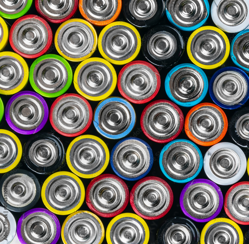 Various Close up background of various alkaline batteries Various Close up background of various alkaline batteries