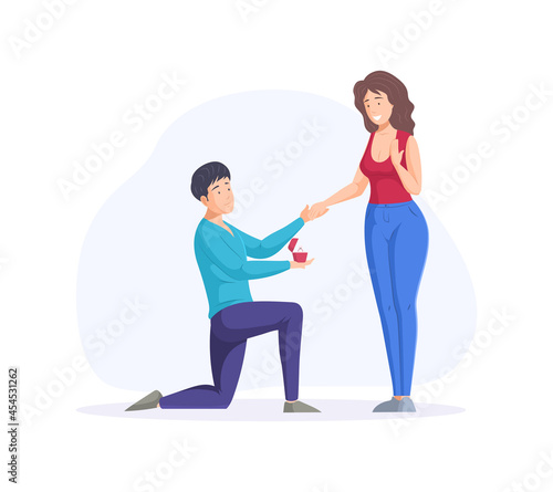 Engagement proposal surprise. Enamored man stands on knee proposing to woman