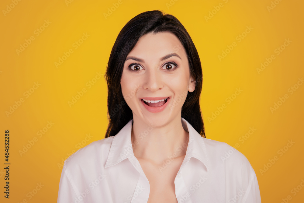 Portrait of pretty cute girl excited face look camera on yellow background Portrait of pretty cute girl excited face look camera on yellow background