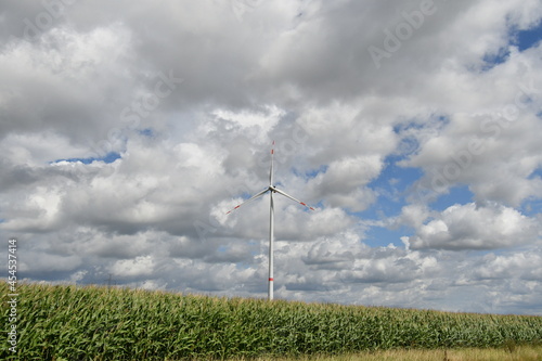 Gigantic electric wind turbine in the middle of the fields in Flanders near tongeren.
