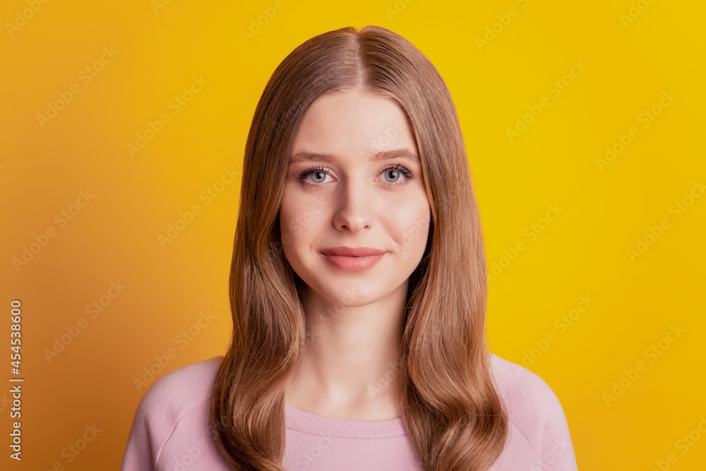 Photo of charming adorable girl look camera on yellow background Photo of charming adorable girl look camera on yellow background