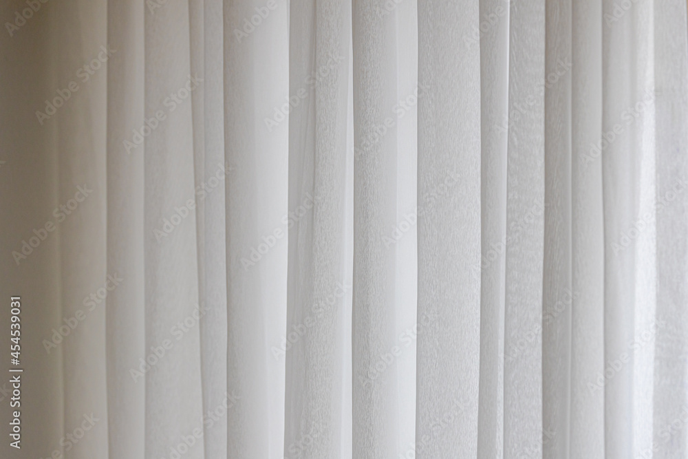 Light and see through, Classic vintage white grey sheer curtains hanging by the window in living room with sunlight in the afternoon and blurred background. - obrazy, fototapety, plakaty 