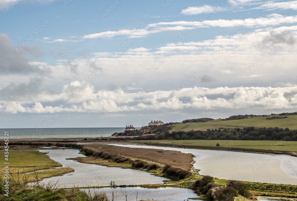 view of the River Cuckmere leading down to the sea at Cuckmere Haven East Sussex England