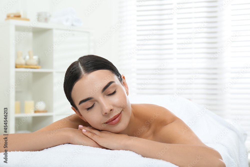 Beautiful young woman relaxing in spa salon Beautiful young woman relaxing in spa salon