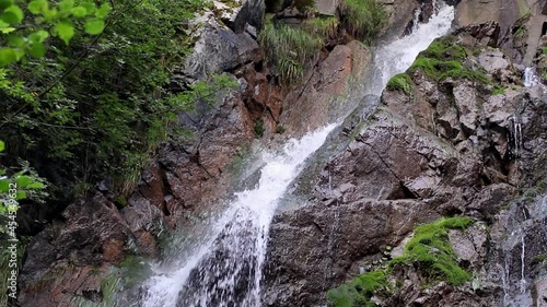 The Masanel Waterfall. A small waterfall in Bocenago, Trentino (South Tyrol, Italy). It is part of Adamello-Brenta national park. photo