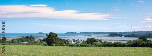 countryside in french brittany under blue sky in summer near paimpol