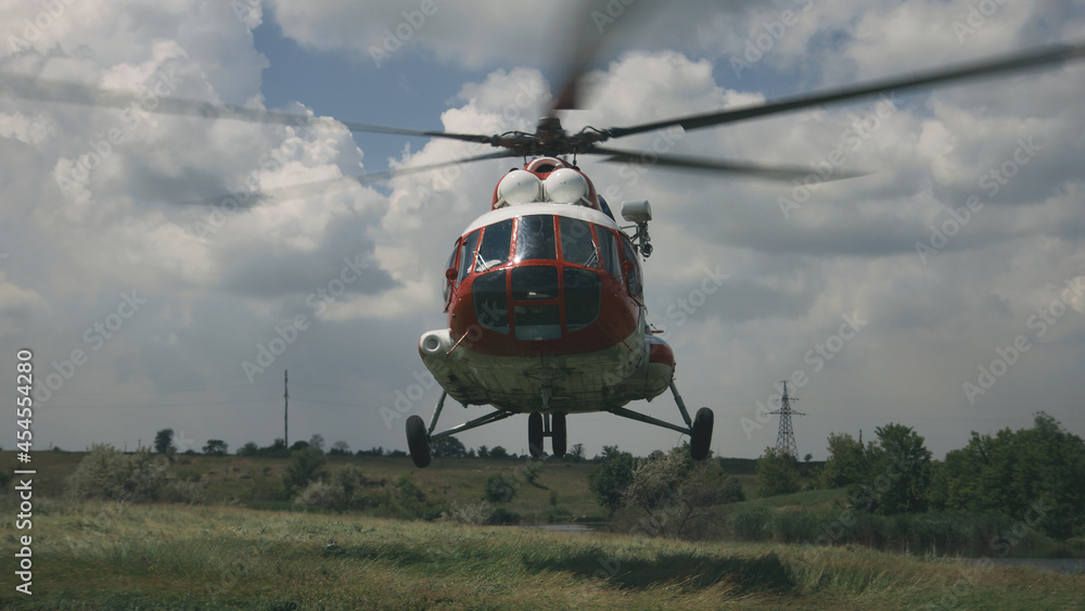 Fototapeta premium Emergency helicopter flying up from field