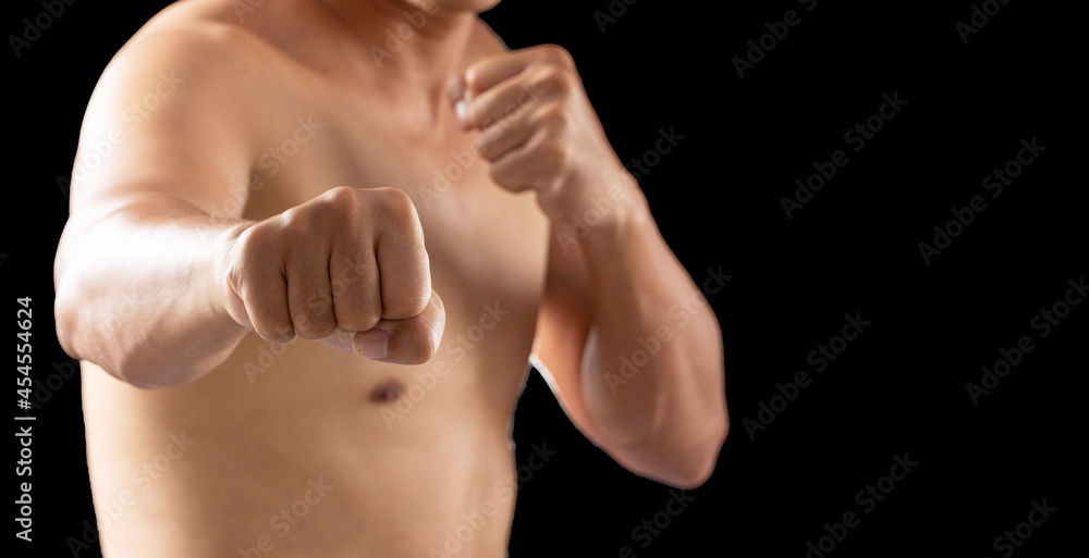 Attack, aggression, aggressive, power strong, survival sign. Hands of fighter man posing punch fight while standing over isolated black background.