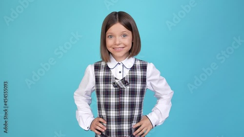 Excited positive nice small schoolgirl show okey sign