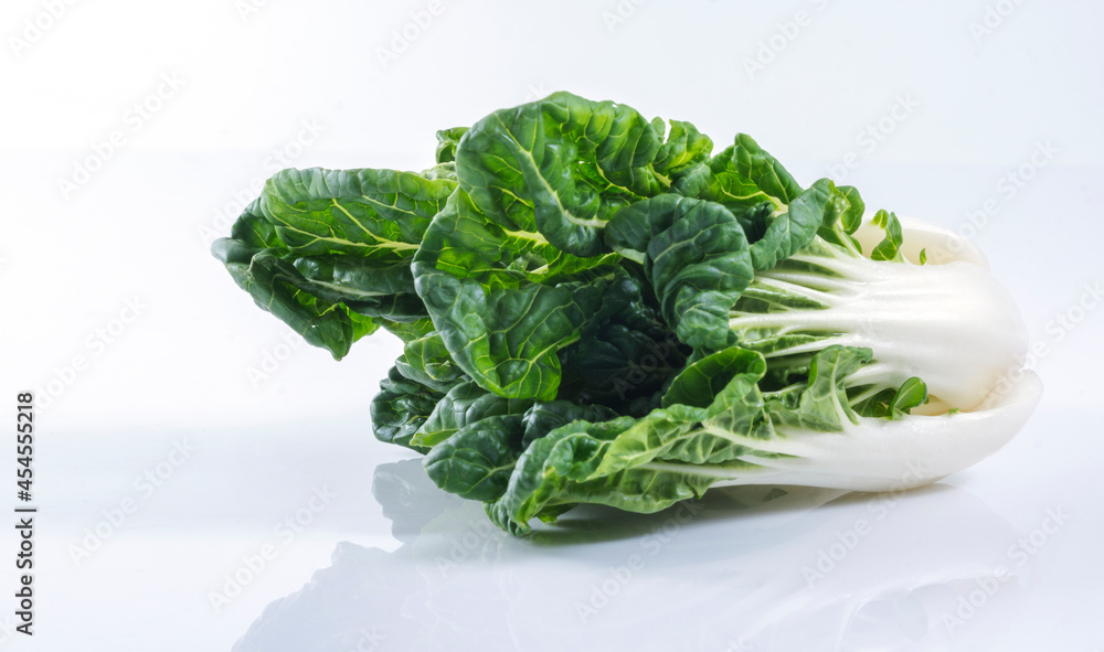 Freshness organic big head green china lettuce vegetarian over isolated white background. Vegetable food health care concept. Freshness organic big head green china lettuce vegetarian over isolated white background. Vegetable food health care concept.