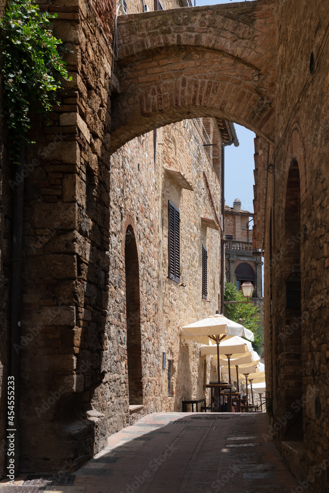 Obraz premium The historic center of San Gimignano, a typical medieval village in Tuscany. Narrow streets, numerous stone towers characterize the urban landscape