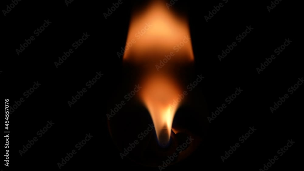 Top view of burner or high speed flamethrower ignite with flame and burns, creates a beautiful glow. Blazing fire and flames against black background. Flames burn in the dark, close up in slow motion. Top view of burner or high speed flamethrower ignite with flame and burns, creates a beautiful glow. Blazing fire and flames against black background. Flames burn in the dark, close up in slow motion.
