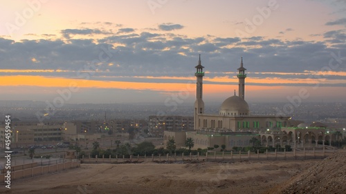 Sheikh Zayed Islamic Center and Sheikh Zayed city view during sunrise © Ossama