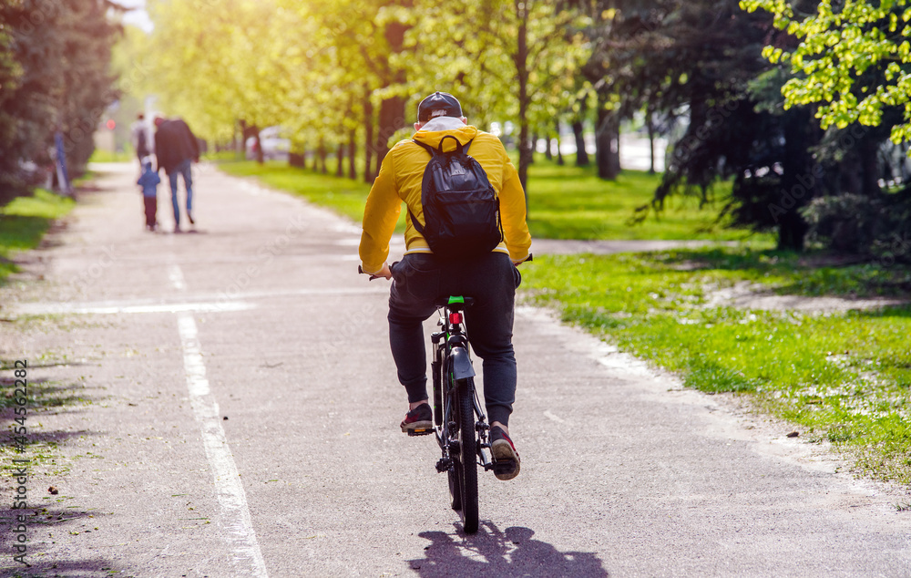 Cyclist ride on the bike path in the city Park
