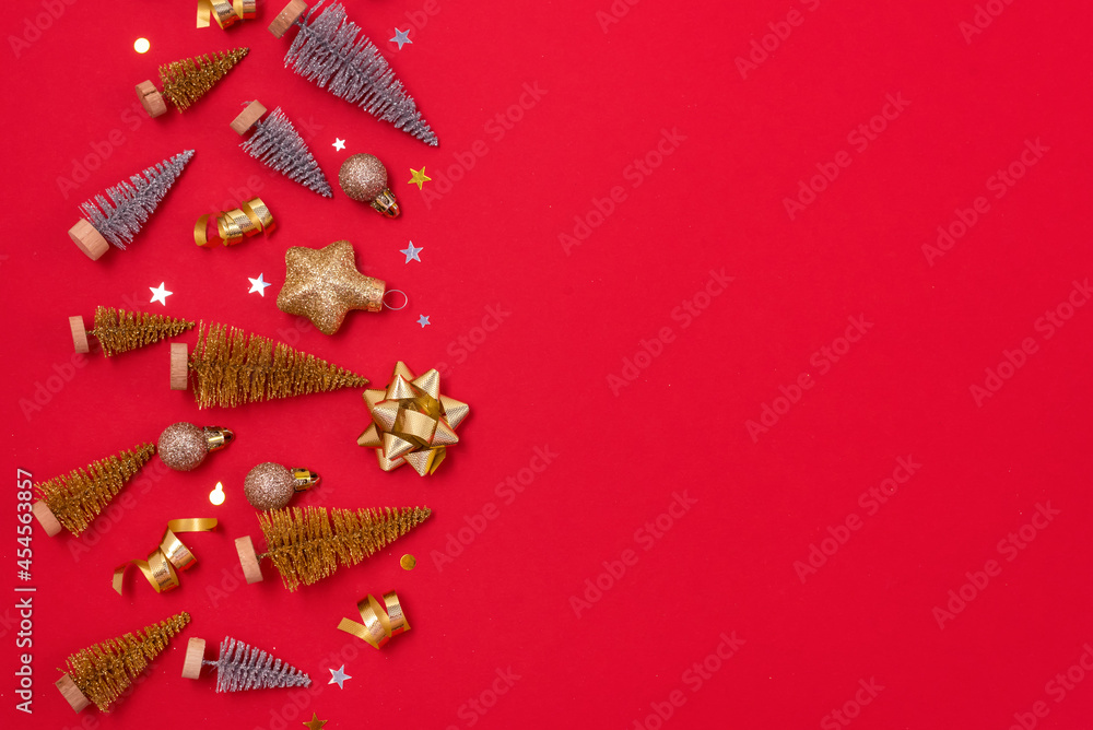 Christmas Background with Gold and Silver Small Christmas Tree Golden Confetti Christmas Balls Holiday Festive Seasonal Background Red Background