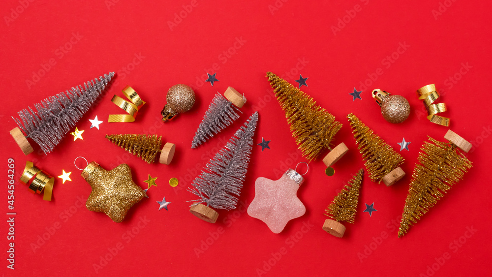Christmas Background with Gold and Silver Small Christmas Tree Golden Confetti Christmas Balls Holiday Festive Seasonal Background Red Background Banner
