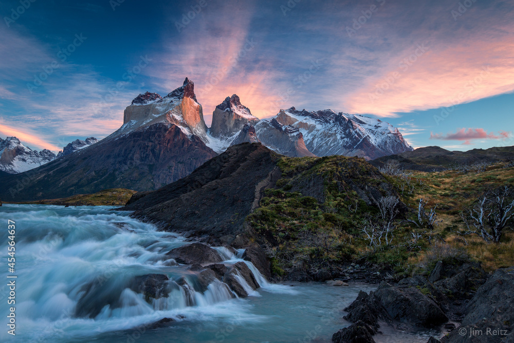 Sunrise over the Salto Grande cascades, with the Cuernos del Paine mountains - in Torres del Paine national park, Chile.