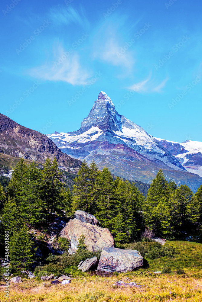Magical beautiful landscape with fir trees on background Matterhorn in the Swiss Alps, near Zermatt, Switzerland. Amazing places. (Meditation, antistress - concept).