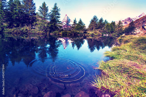 Obraz na płótnie picturesque beautiful landscape with lake and fir trees on background Matterhorn in the Swiss Alps, near Zermatt, Switzerland. Amazing places. (Meditation, antistress - concept). w salonie