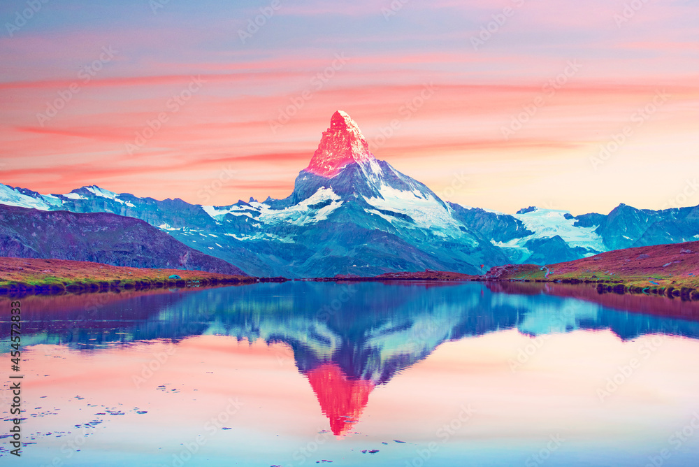 Fantastic landscape with the beauty illuminated by the top of the mountain Matterhorn in the morning sun in the Swiss Alps and Lake Stellisee, near Zermatt, Switzerland. Amazing placec.