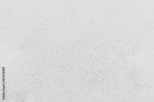 Dirty light gray or white paint on the surface of the concrete wall texture background