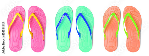 Fotografía Set with different colorful flip flops on white background, top view