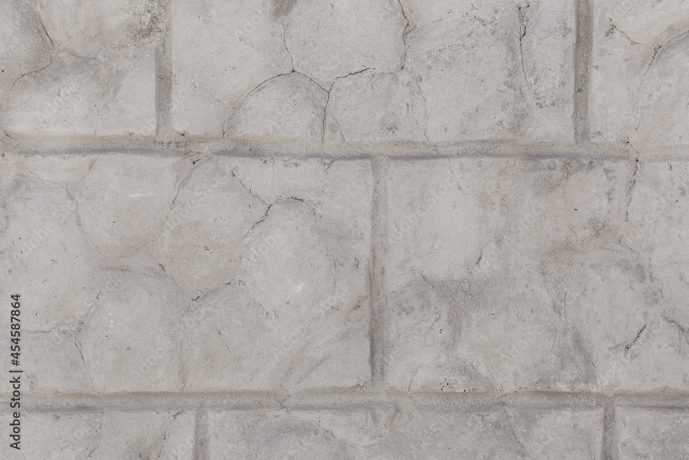 Weathered brick old gray broken wall with cracks texture damaged stone background Weathered brick old gray broken wall with cracks texture damaged stone background