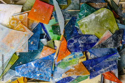 Fragments of old stained glass in the workshop photo