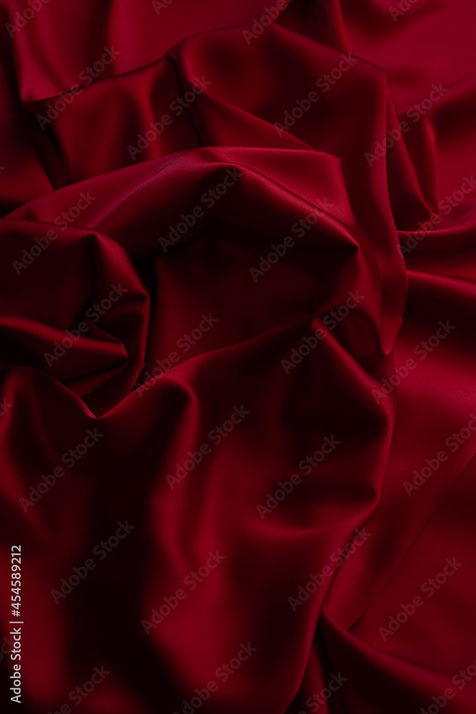 Red smooth cloth folds texture background Red smooth cloth folds texture background