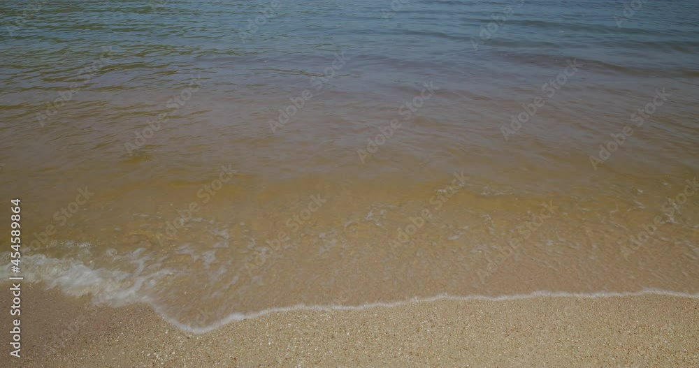 Sea wave over sand beach Sea wave over sand beach