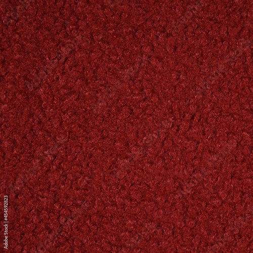 Curly knit boucle fabric texture in burnt orange