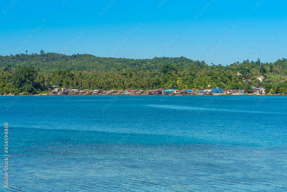 View to the small town Bomba in the north-east of the Togian island of Batudaka. The fishing village is the starting point for divers and tourists who want to visit the resorts and dive spots