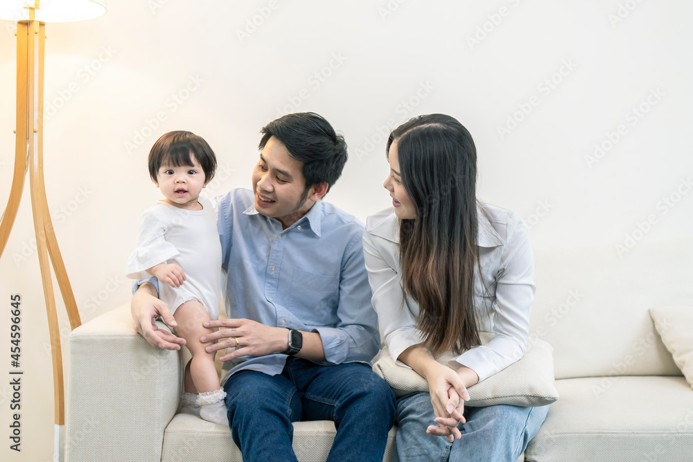 Asian Parents and a kid child playing at home. Family concept. Asian Parents and a kid child playing at home. Family concept.