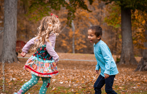 Boy and girl playing tag